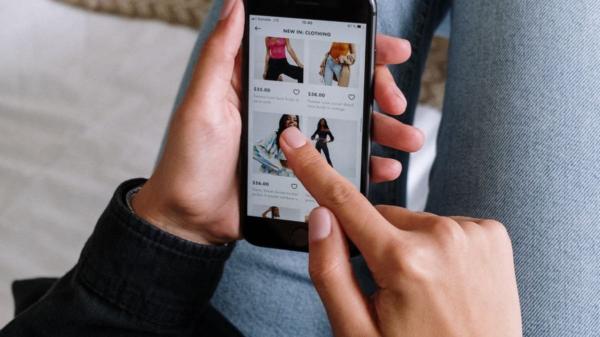 Person browsing homes on a smartphone