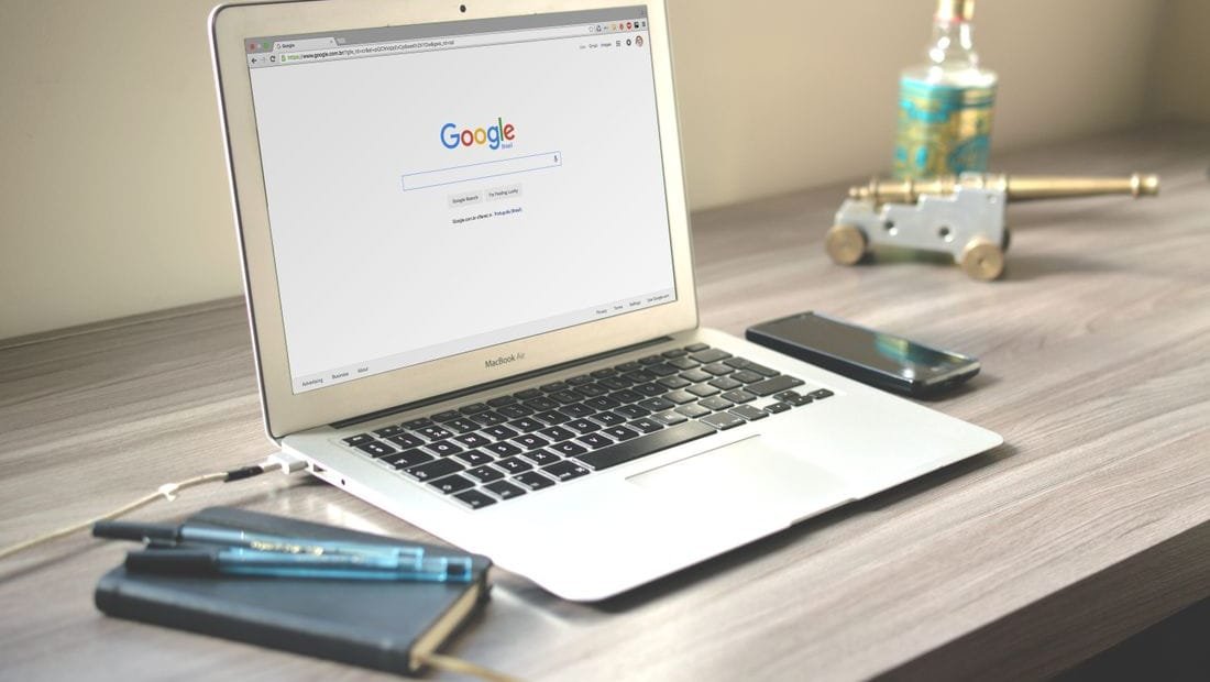 Social media analytics and scheduling dashboard on a laptop