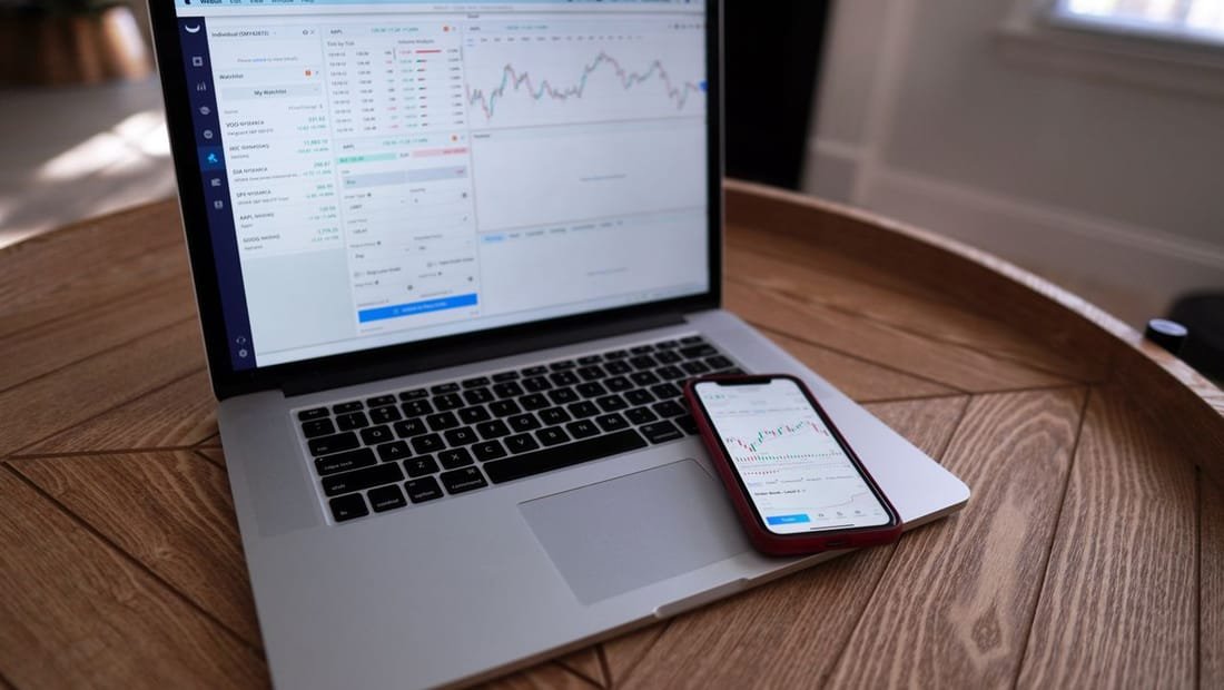A real estate website displayed on a laptop on a clean desk